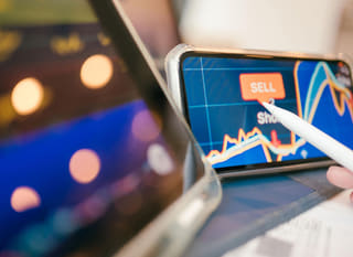 Trader across several markets reviewing forex options alongside Bitcoin and Ethereum
